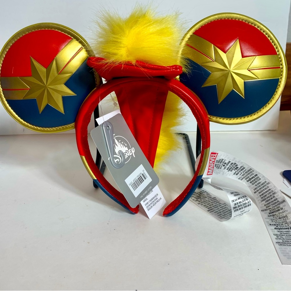 NWT. Disney Captain Marvel's symbol adorns the ears of these ears headband